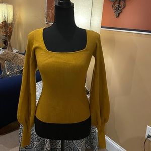 A Mustard colored Balloon sleeve sweater